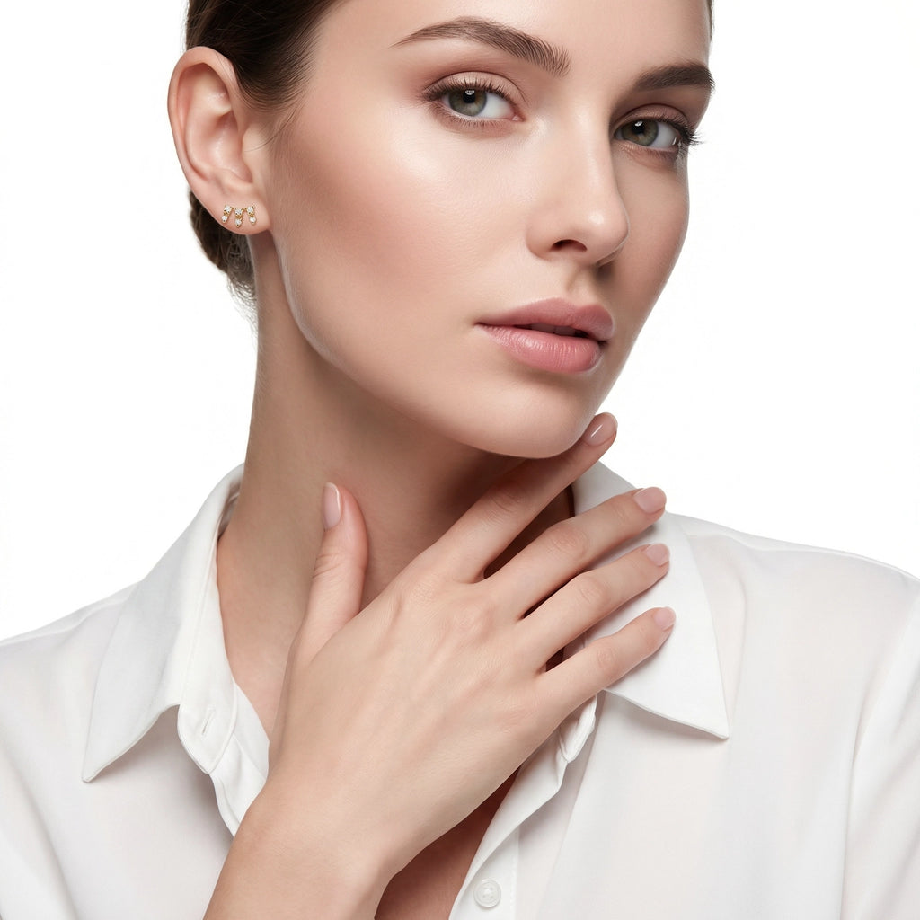 14K Yellow Gold Mini Crown design diamond stud earrings, featuring a delicate prong-set crown motif with sparkling round brilliant diamonds. Women Wearing