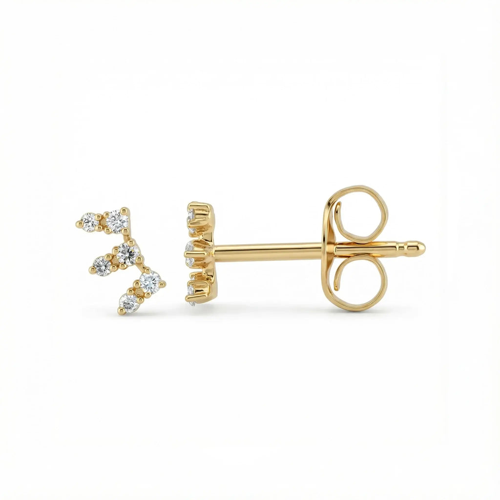 A sleek pair of 14K Yellow Gold Seven-Stone Diamond Climber Earrings, featuring seven round brilliant diamonds set in a straight line that elegantly ascends the ear.