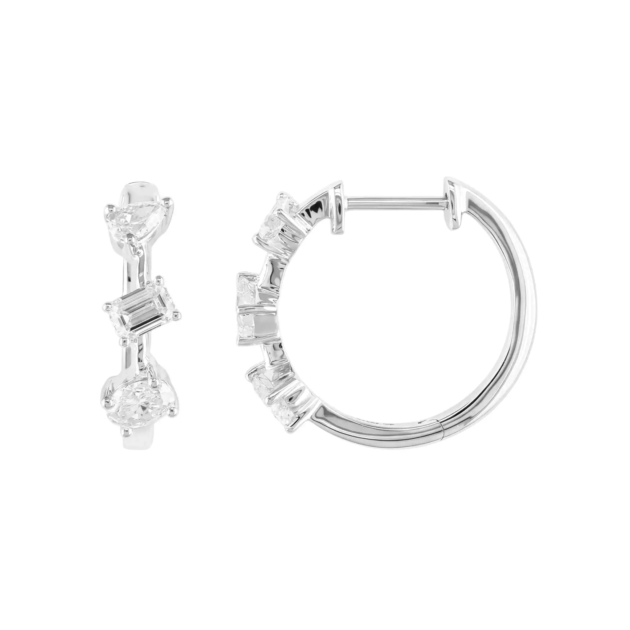 A pair of 14K White Gold Huggie Hoop Earrings featuring a contemporary geometric design with an assortment of pear, baguette, and oval cut diamonds.