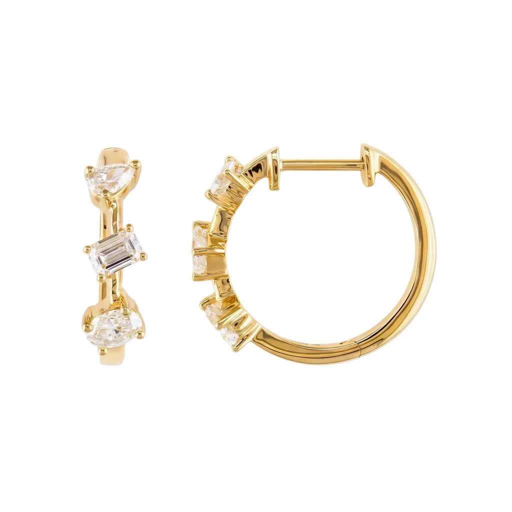 A pair of 14K Yellow Gold Huggie Hoop Earrings featuring a contemporary geometric design with an assortment of pear, baguette, and oval cut diamonds.