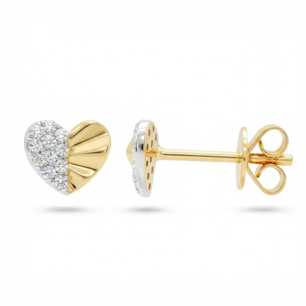 A pair of delicate heart-shaped diamond stud earrings in two-tone 14K gold, featuring a yellow gold heart outline filled with sparkling round diamonds set in white gold.