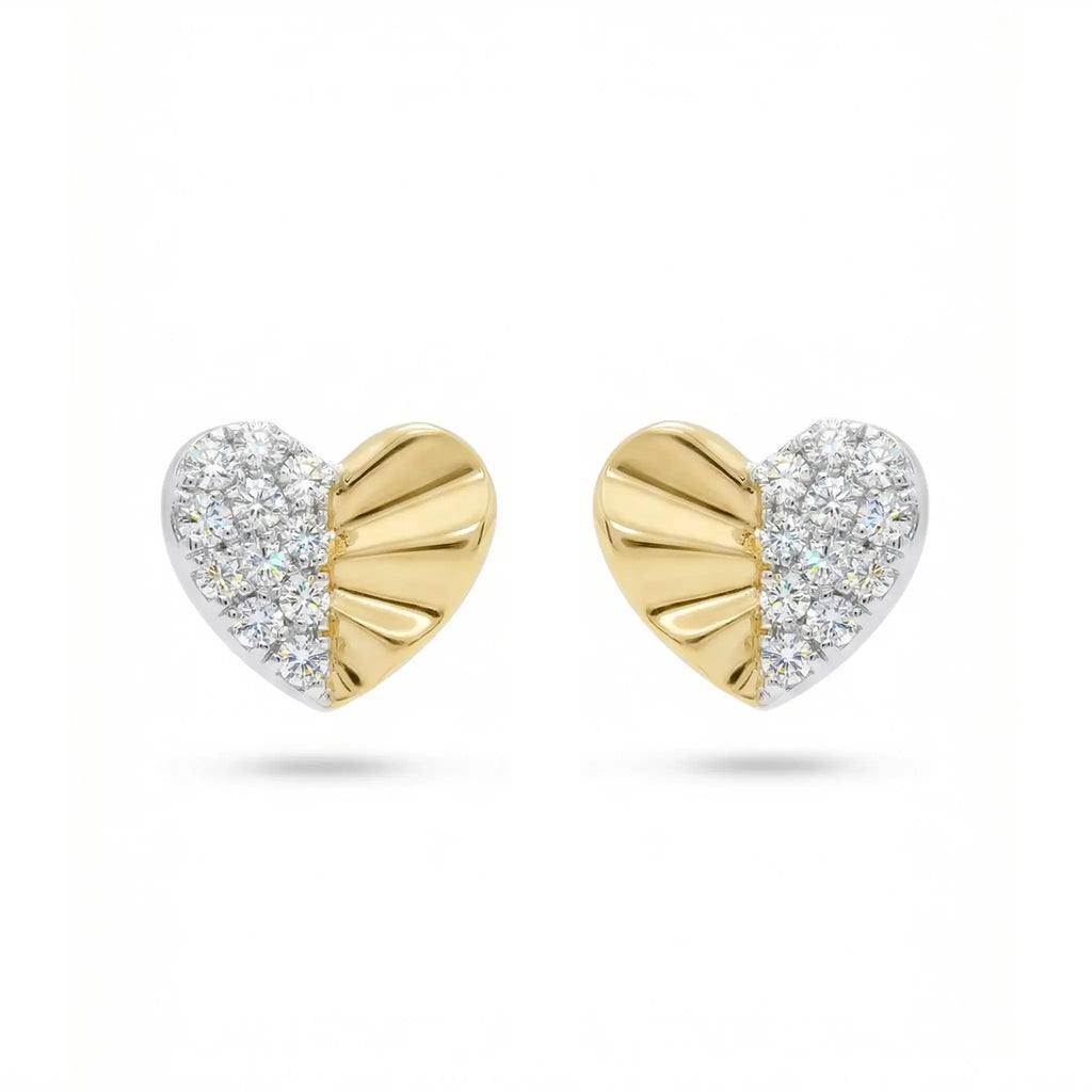 A pair of delicate heart-shaped diamond stud earrings in two-tone 14K gold, featuring a yellow gold heart outline filled with sparkling round diamonds set in white gold.