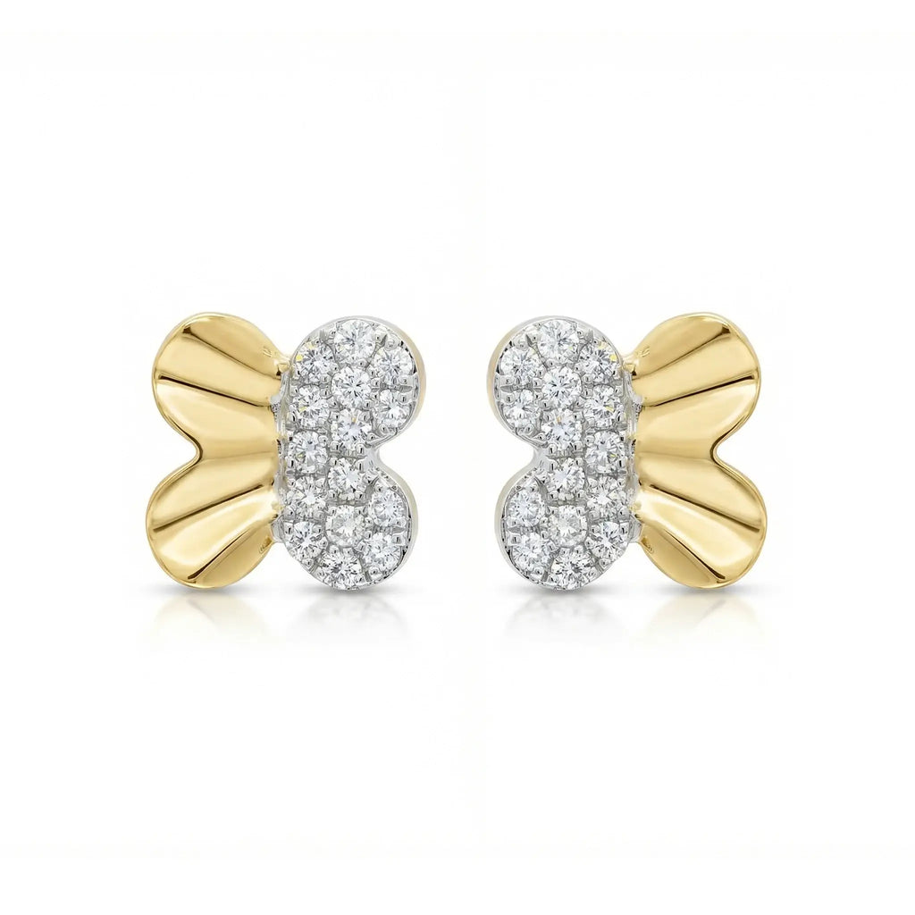 A pair of delicate, sparkling butterfly stud earrings in two-tone 14K gold, with a yellow gold body and white gold wings set with round brilliant diamonds.
