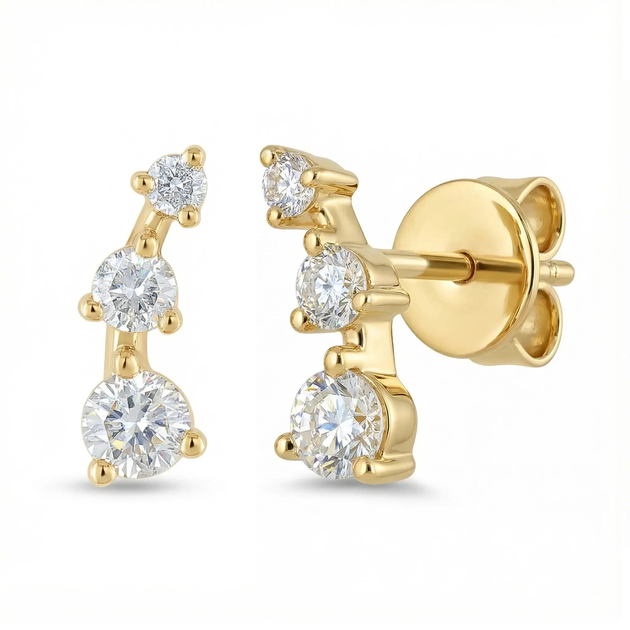 A sleek 14K yellow gold ear crawler earring, featuring three round brilliant diamonds set in a straight, minimalist line that ascends the earlobe.