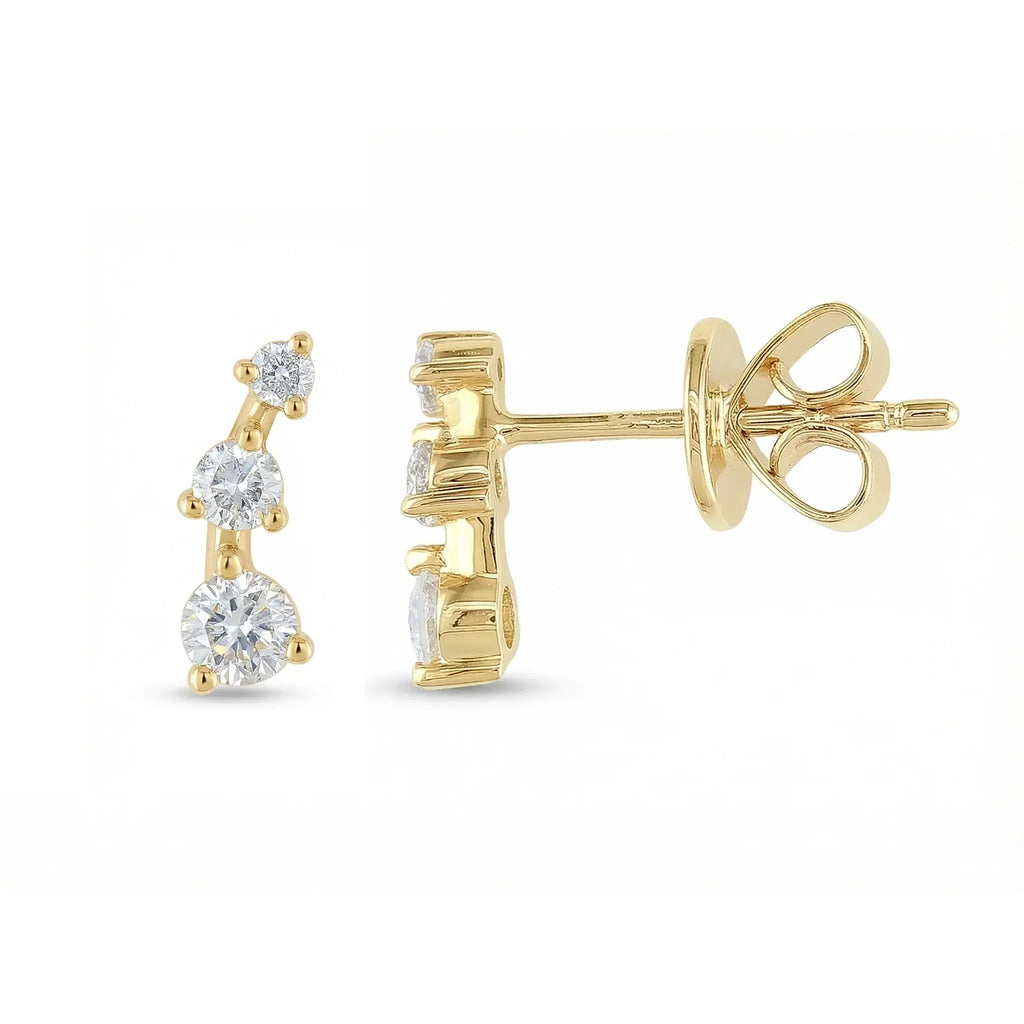 A sleek 14K yellow gold ear crawler earring, featuring three round brilliant diamonds set in a straight, minimalist line that ascends the earlobe.