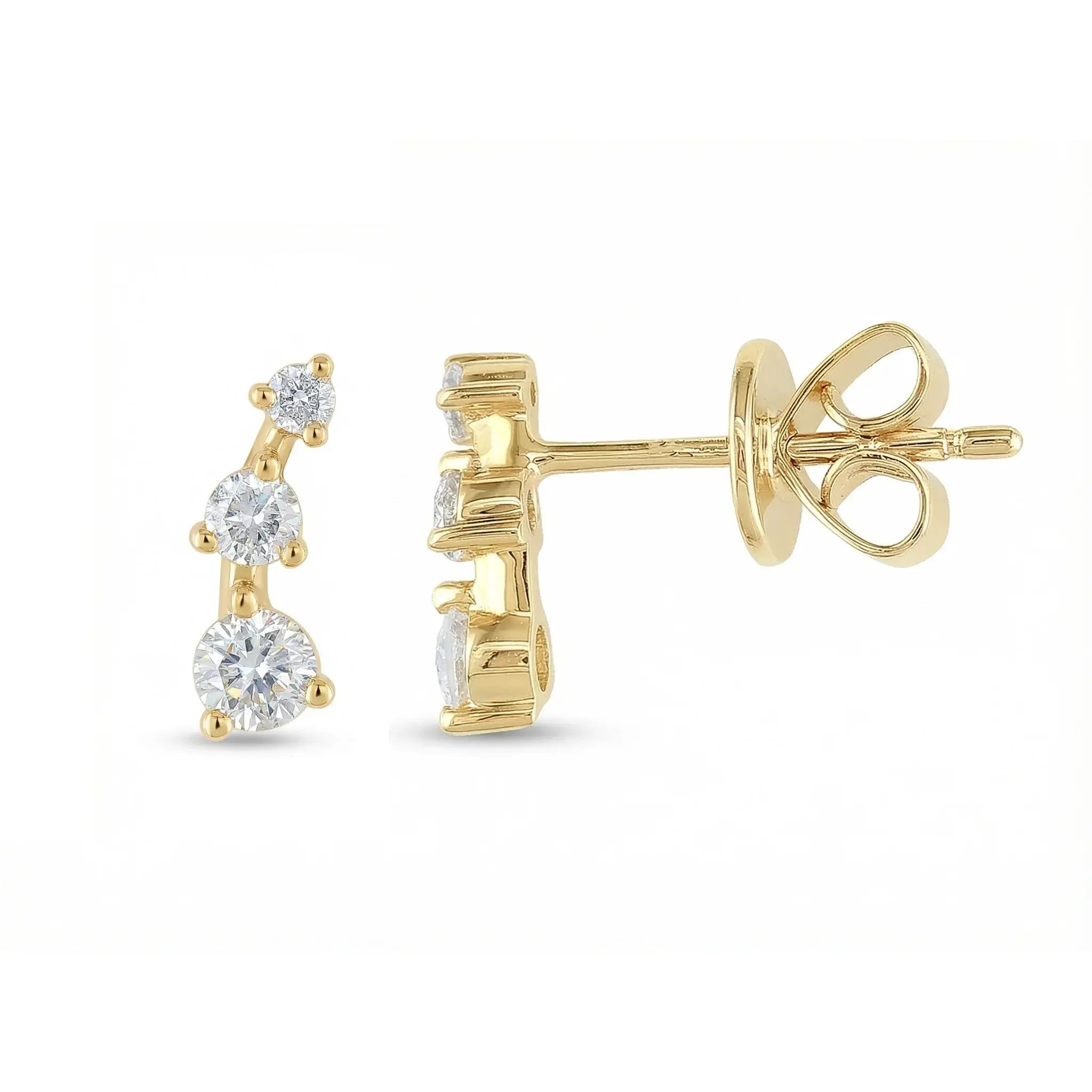 A sleek 14K yellow gold ear crawler earring, featuring three round brilliant diamonds set in a straight, minimalist line that ascends the earlobe.