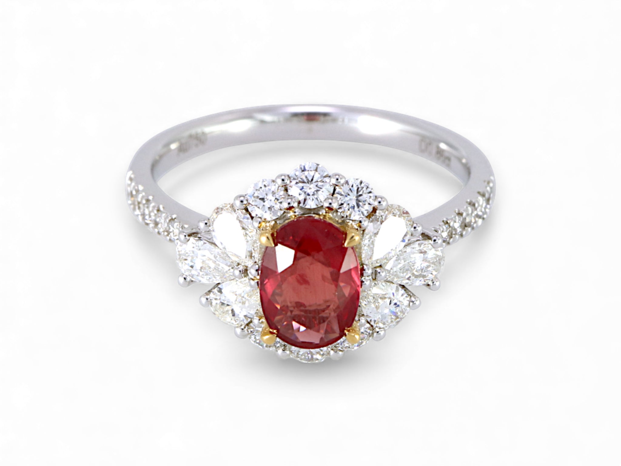 18K White and Yellow Gold Oval Cut Ruby with Pear Cut Diamond Halo Ring