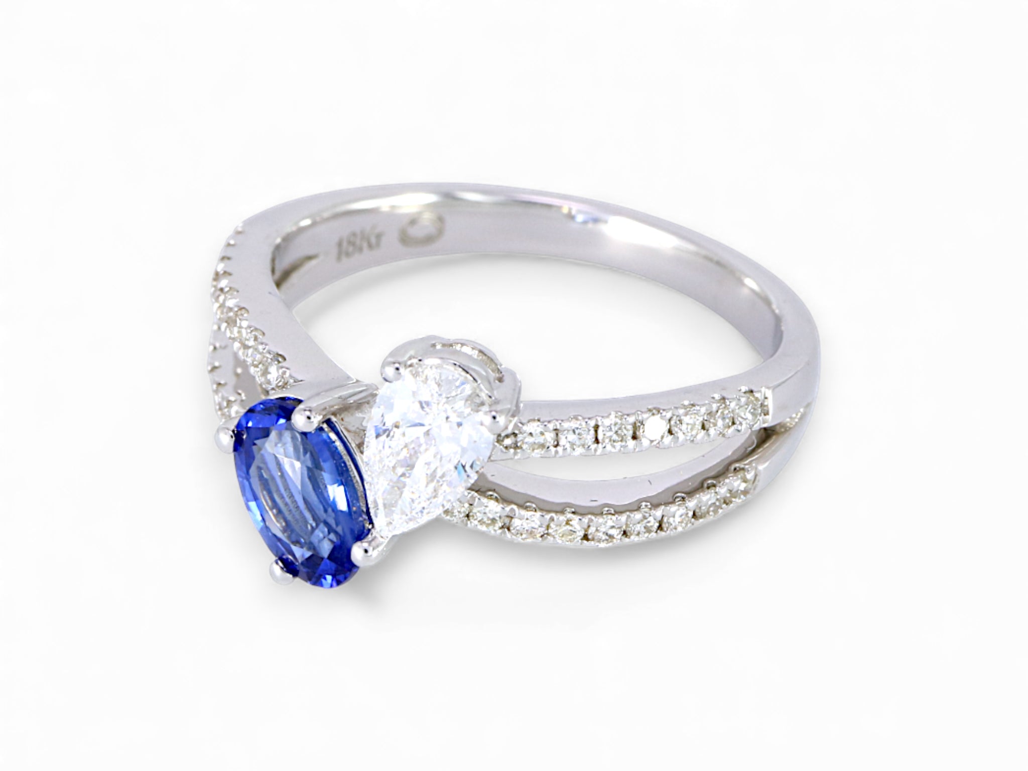 18K White Gold Oval Cut Sapphire and Pear Cut Diamond Ring