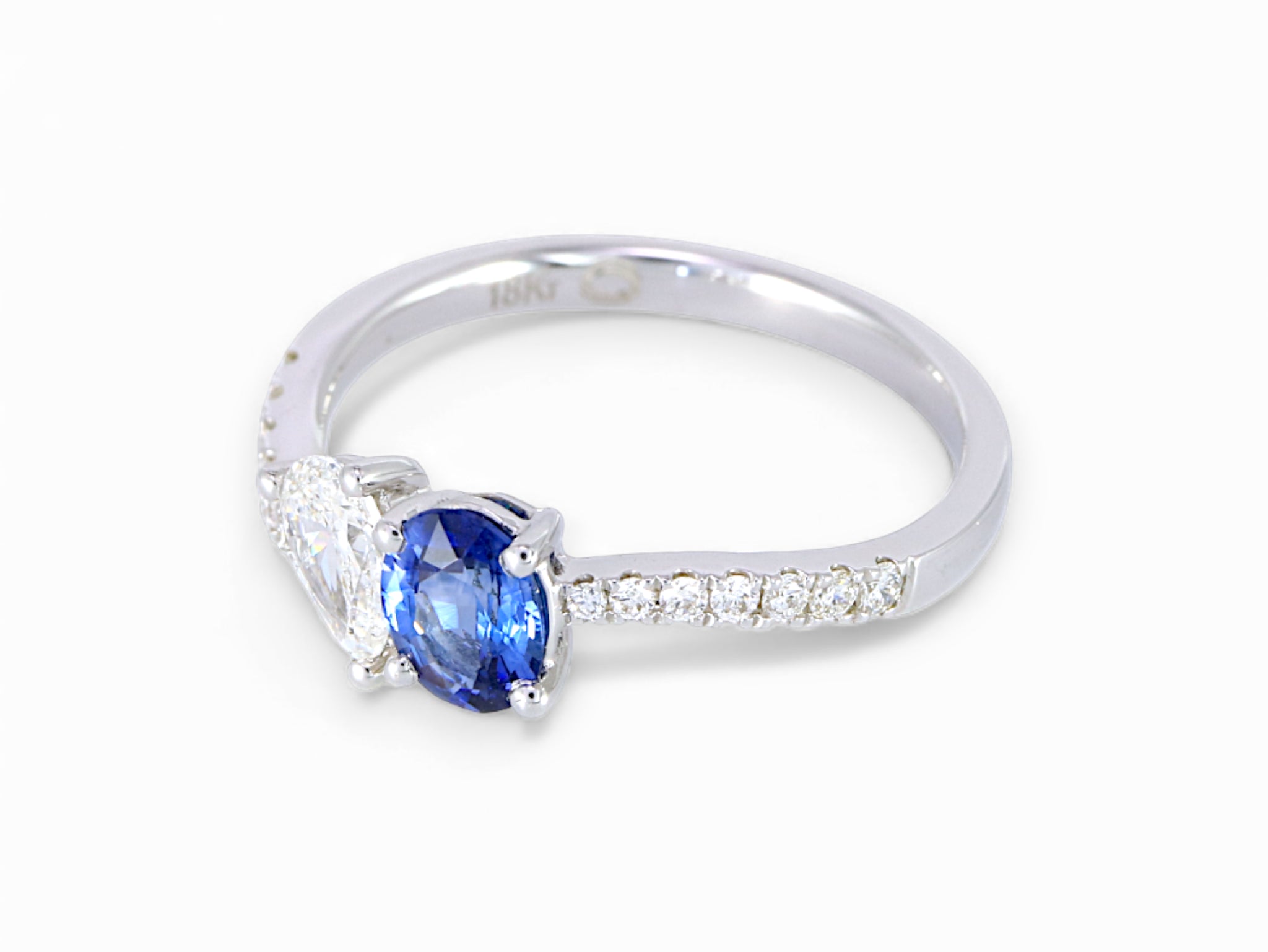 18K White Gold Oval Cut Sapphire and Pear Cut Diamond Ring