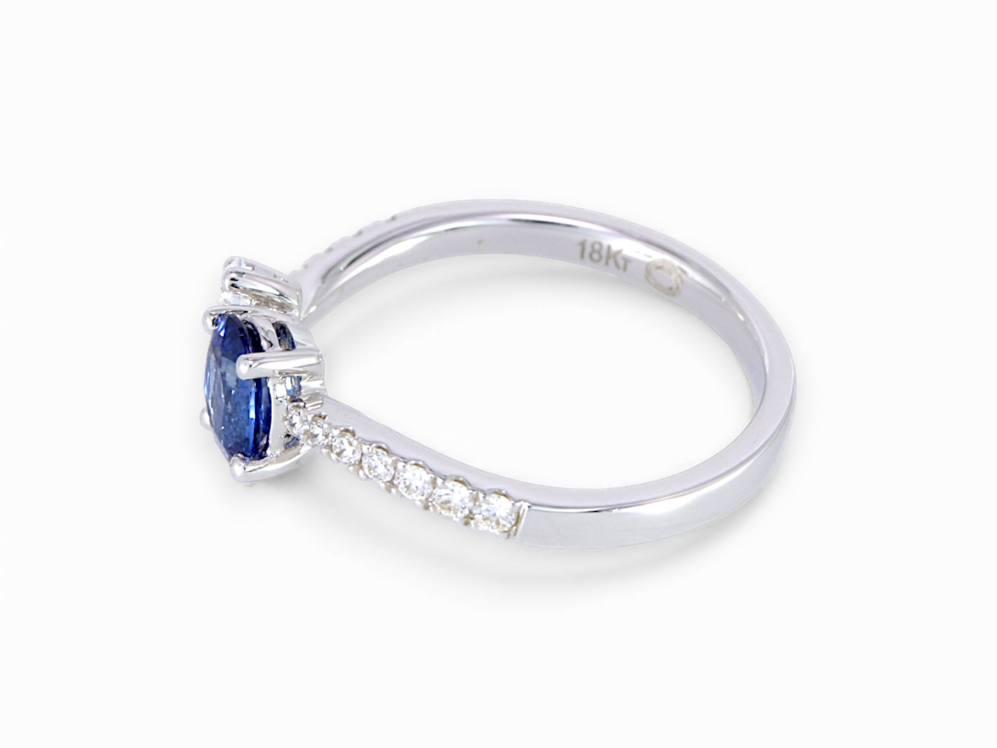 18K White Gold Oval Cut Sapphire and Pear Cut Diamond Ring