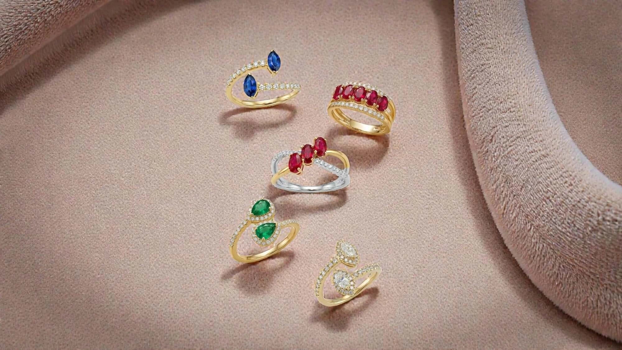 A curated selection of BeBling anniversary jewelry including an eternity ring, a diamond pendant, and a tennis bracelet, elegantly arranged on a velvet tray.