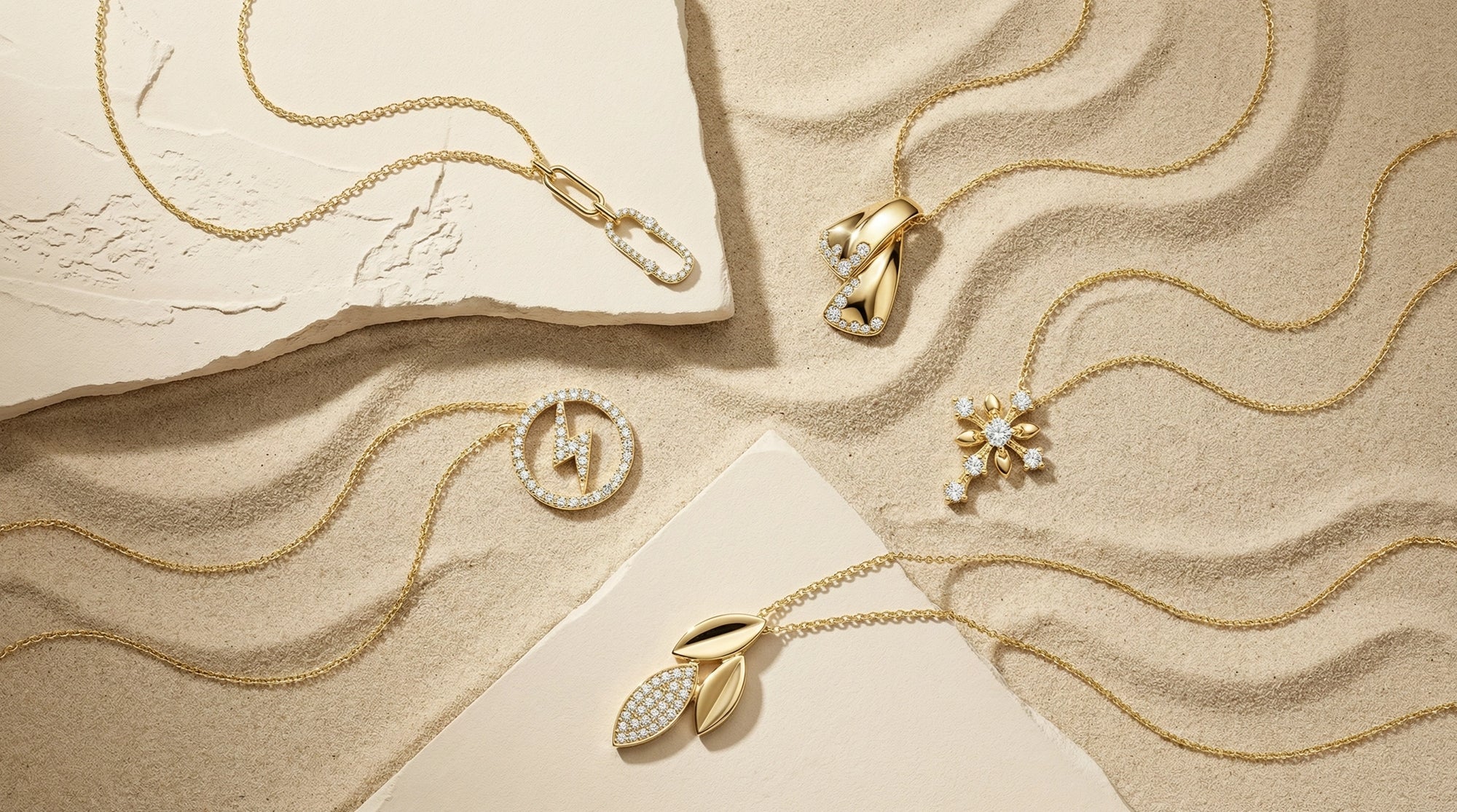 A curated flat lay of BeBling pendant necklaces showcasing a variety of styles: a solitaire diamond, a geometric bar, and an initial pendant in different chain lengths.